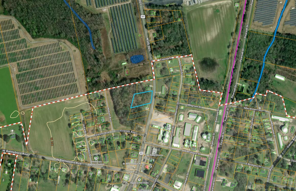 County GIS map with the parcel outlined in blue and the Rocky Mount city limit boundary shown as a red dashed line running around it.