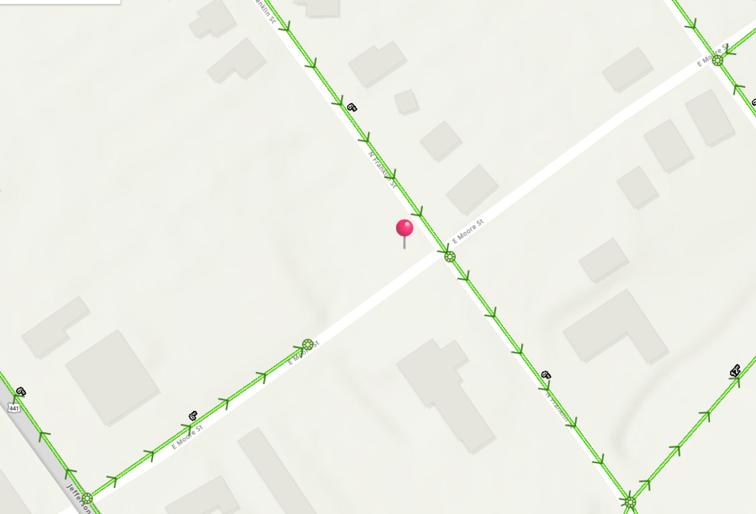 City of Dublin sewer map showing gravity sewer mains along both N Franklin Street and E Moore Street with a manhole at the intersection, and the property marked with a pin.
