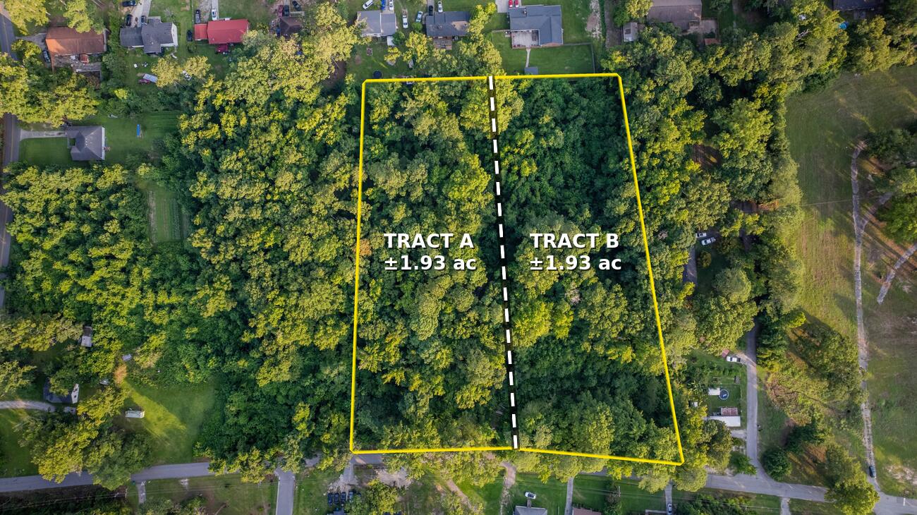 Overhead aerial with the parcel outlined in yellow and a dashed line showing the recorded division, Tract A on the left and Tract B on the right, 1.93 acres each, with existing homes on the adjoining lots.