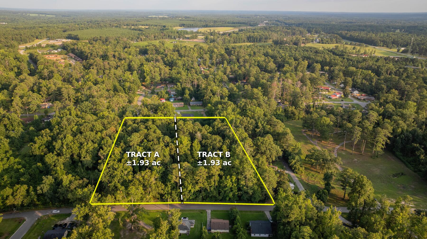 Aerial view of the two recorded tracts on Forrest Clary Drive in Thomson, Georgia, boundary outlined in yellow with a dashed line showing the recorded division, Tract A on the left and Tract B on the right, 1.93 acres each.